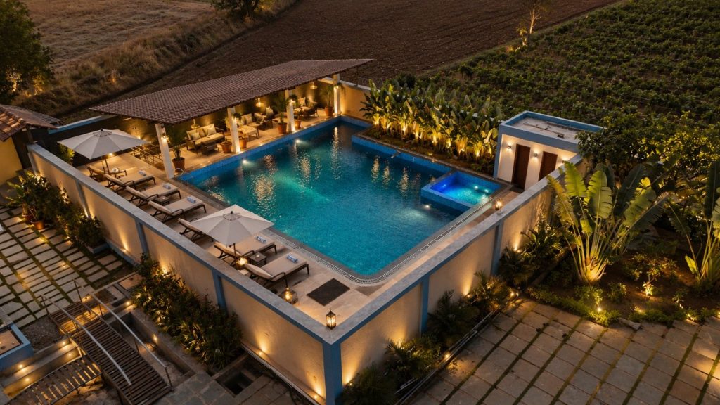 Swimming pool and deck at night, seen from above