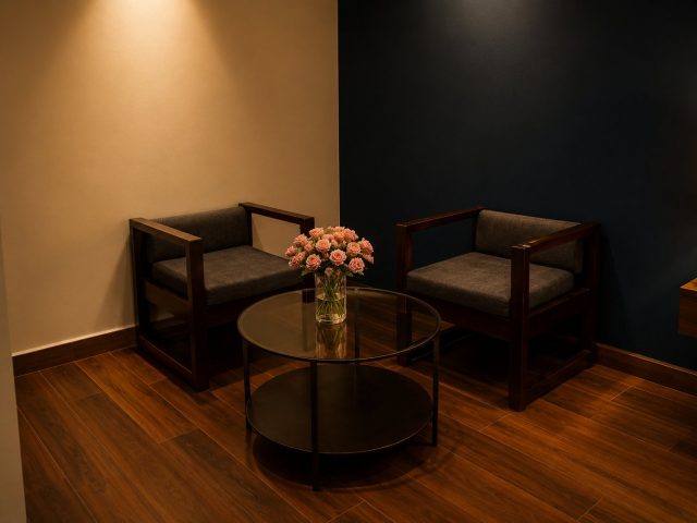 Two armchairs and a glass table in an Executive Room without Balcony