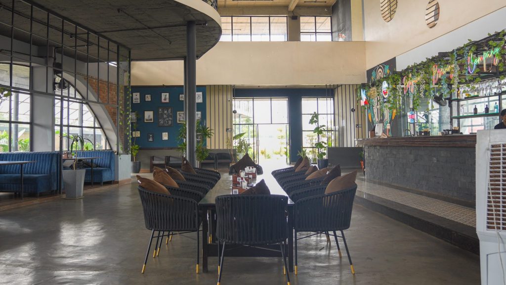 Dining tables near the bar at Belagavi Brewing Company